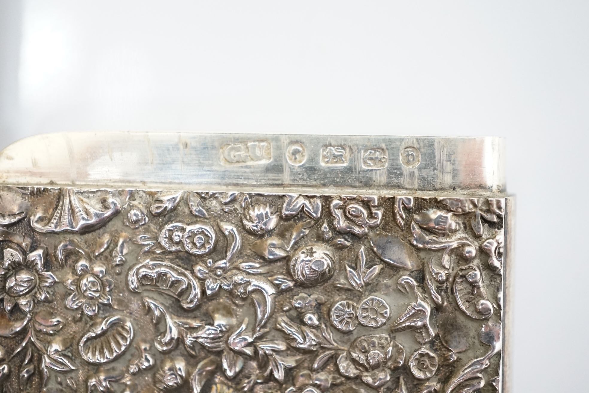 A Victorian silver ‘thousand flower’ card case, George Unite, Birmingham, 1882, 78mm. Condition - fair